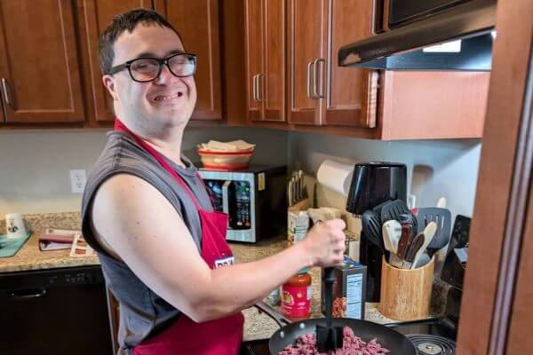 A resident cooking in his own kitchen