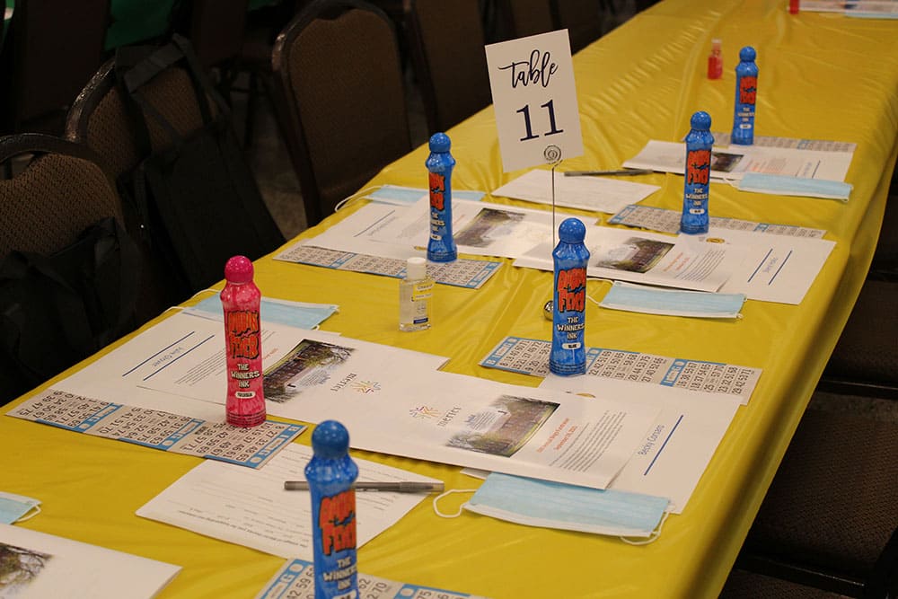Tables set with bingo cards and daubers