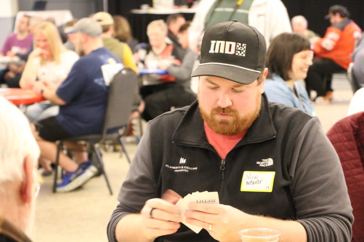 A player studies his hand at the Euchre Tournament