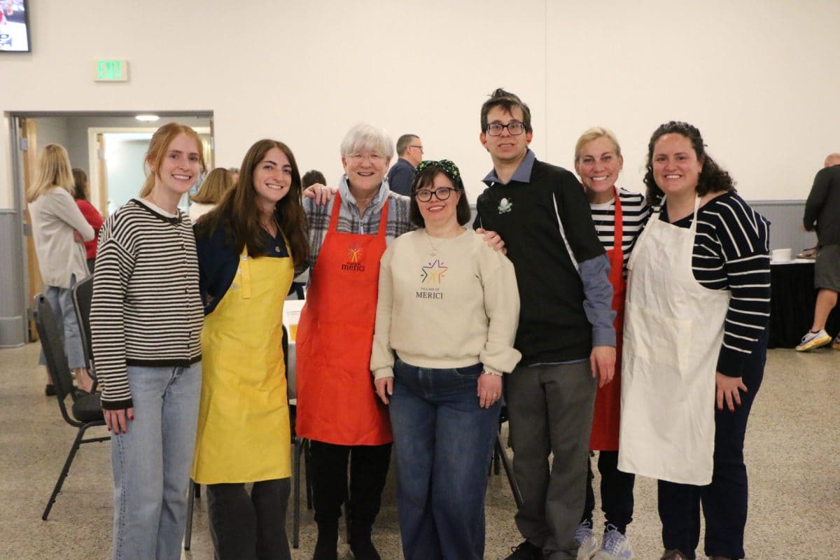 Volunteers in aprons at the Euchre Tournament