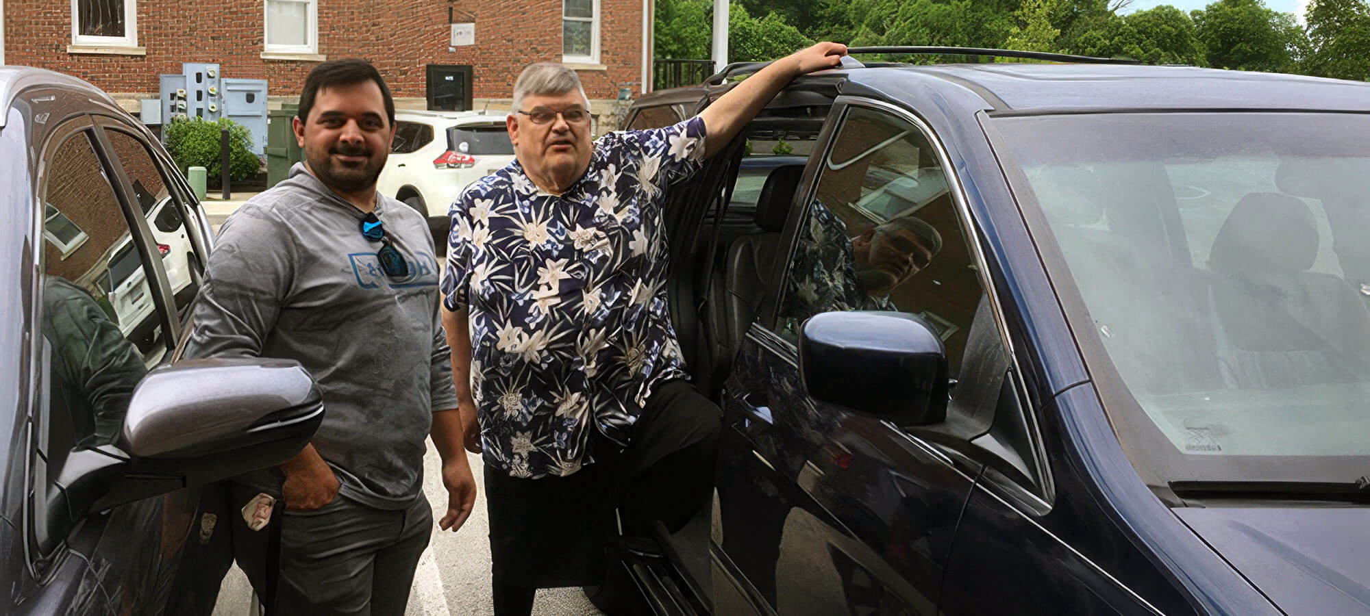A Merici City Rides volunteer driver helping a rider into the car