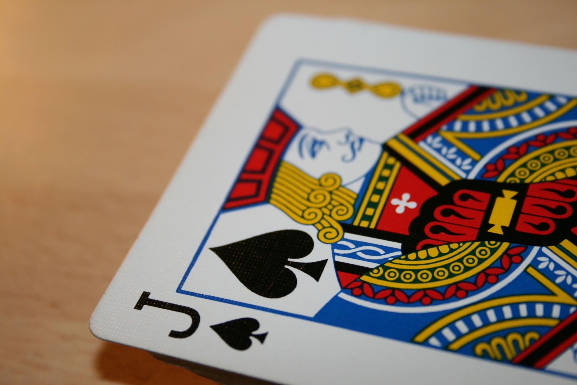 special-event-euchre-hero A jack of spades playing card on a table