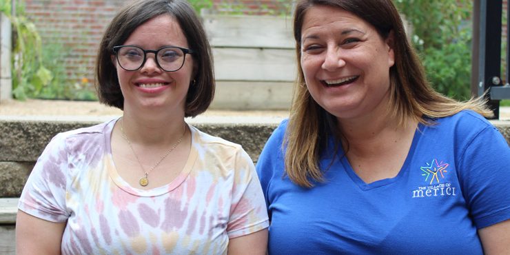 A Village of Merici staff member and a person we support together outdoors