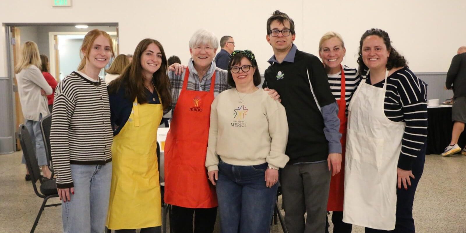 Volunteers and the People we support at a Village of Merici event
